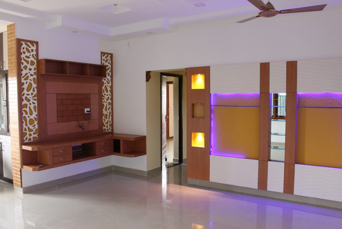 Finished hall with a TV unit and backlit display niches